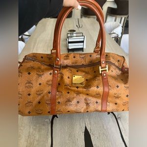 MCM weekender / Gym bag very clean . Lining inside is perfect. 20 inches long .